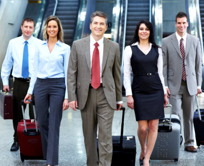 Smiling employees walking down in escalator